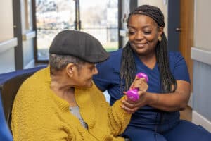 Rehab therapist working with a resident at Norwood Towers